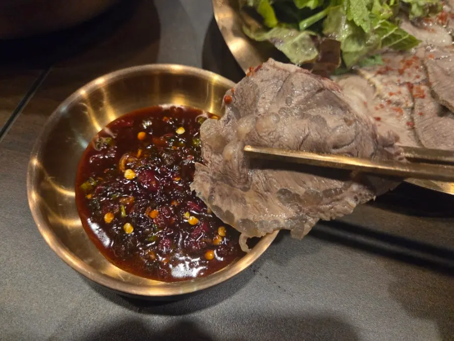 Half plate of suyuk served with dipping sauce