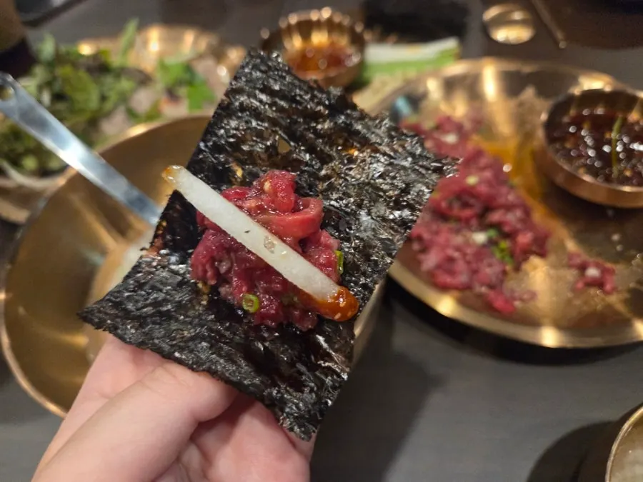 Yukhoe served with pear and chives