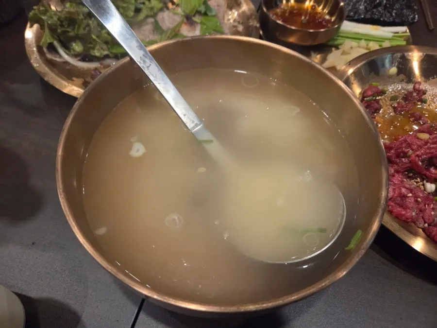 Table with yukhoe, suyuk, and gomtang all together