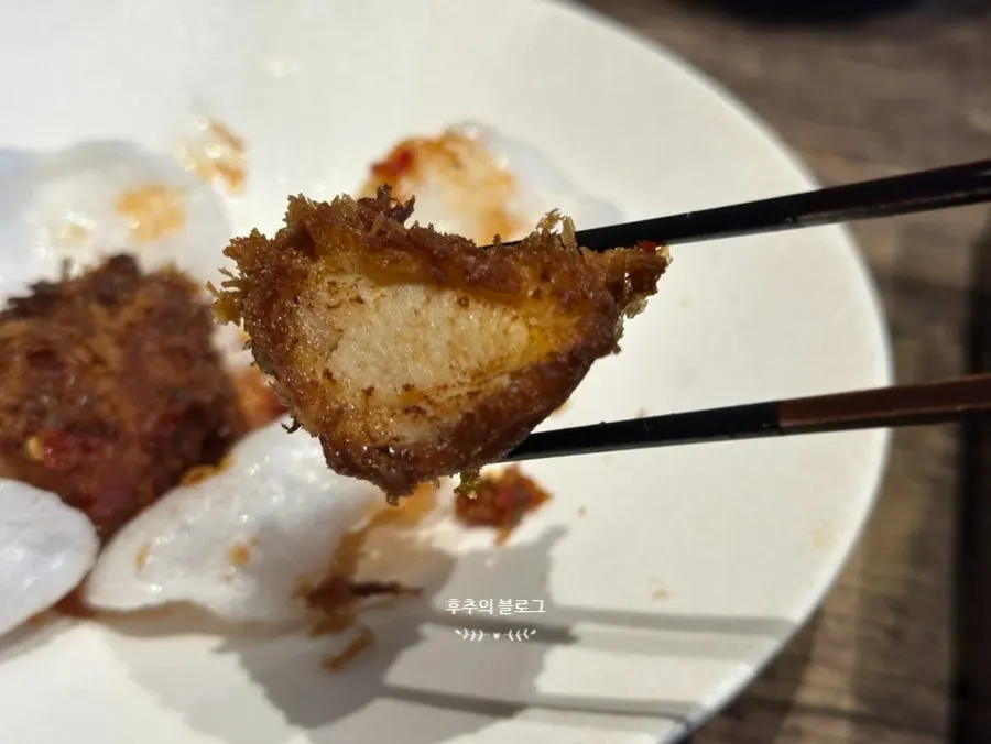 Dipping kaisendon in soy sauce