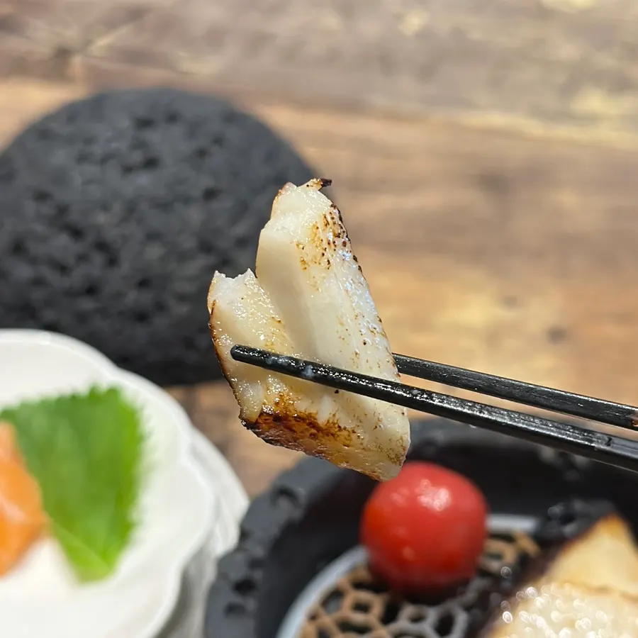 Grilled fish course dish served before sushi