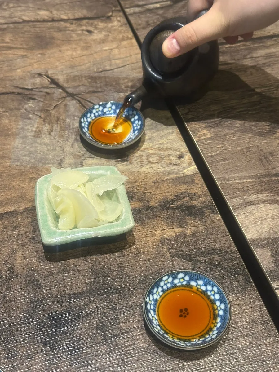 Soy sauce and a glass of water set out in advance