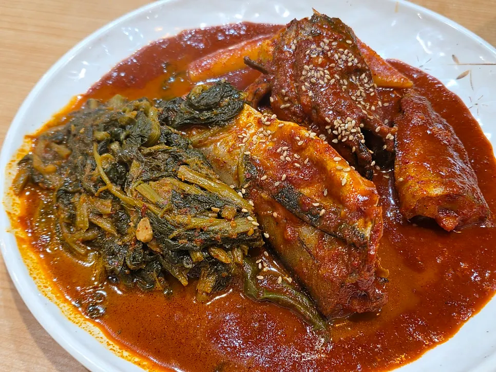 A full serving of sikeumchi braised pollock coated in sauce