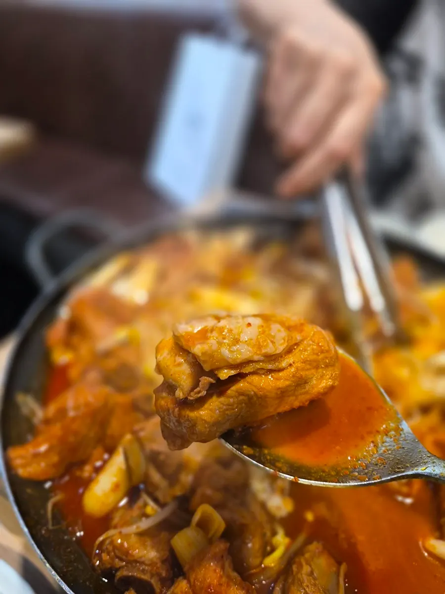 Spicy braised sauce with color changed after simmering down
