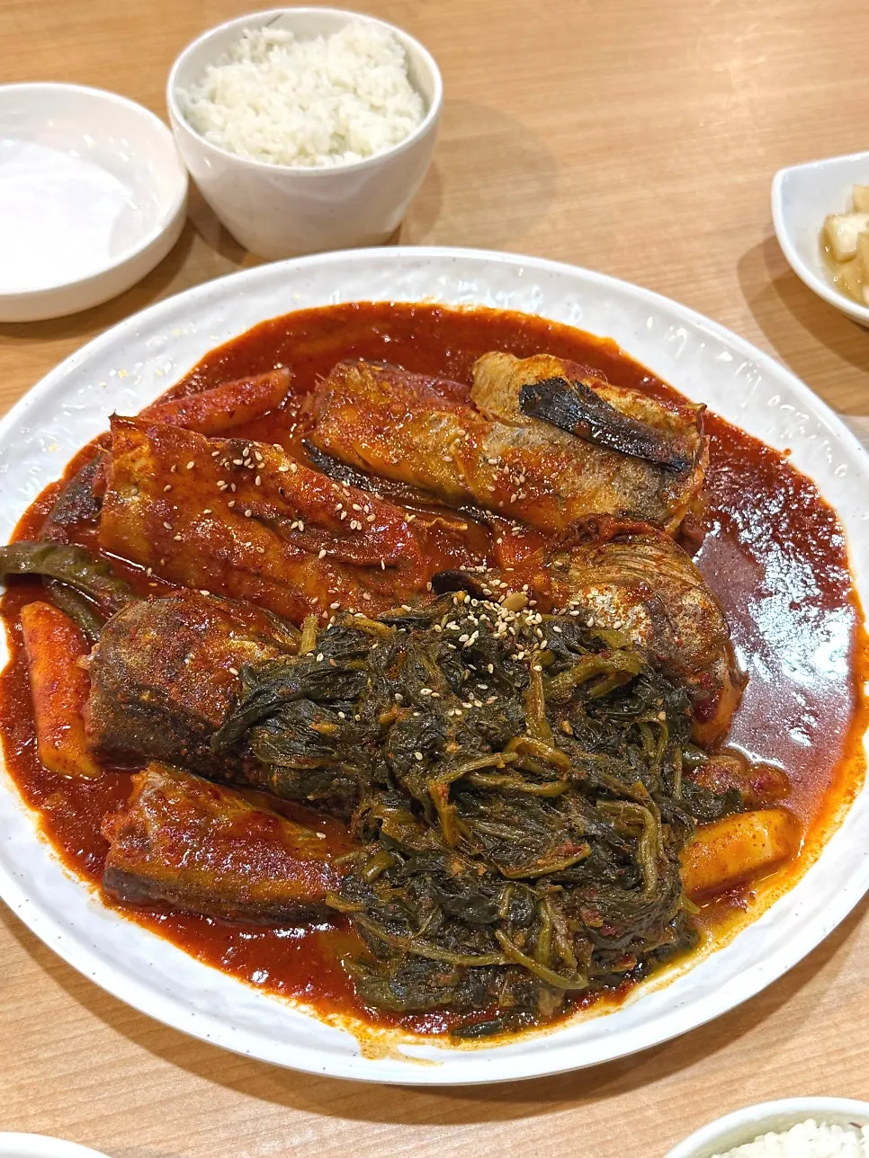 Vertical shot of the vividly red siraegi braised pollock