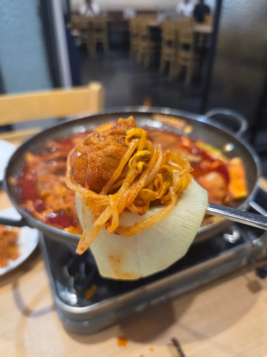 A large piece of rib deeply soaked in sauce