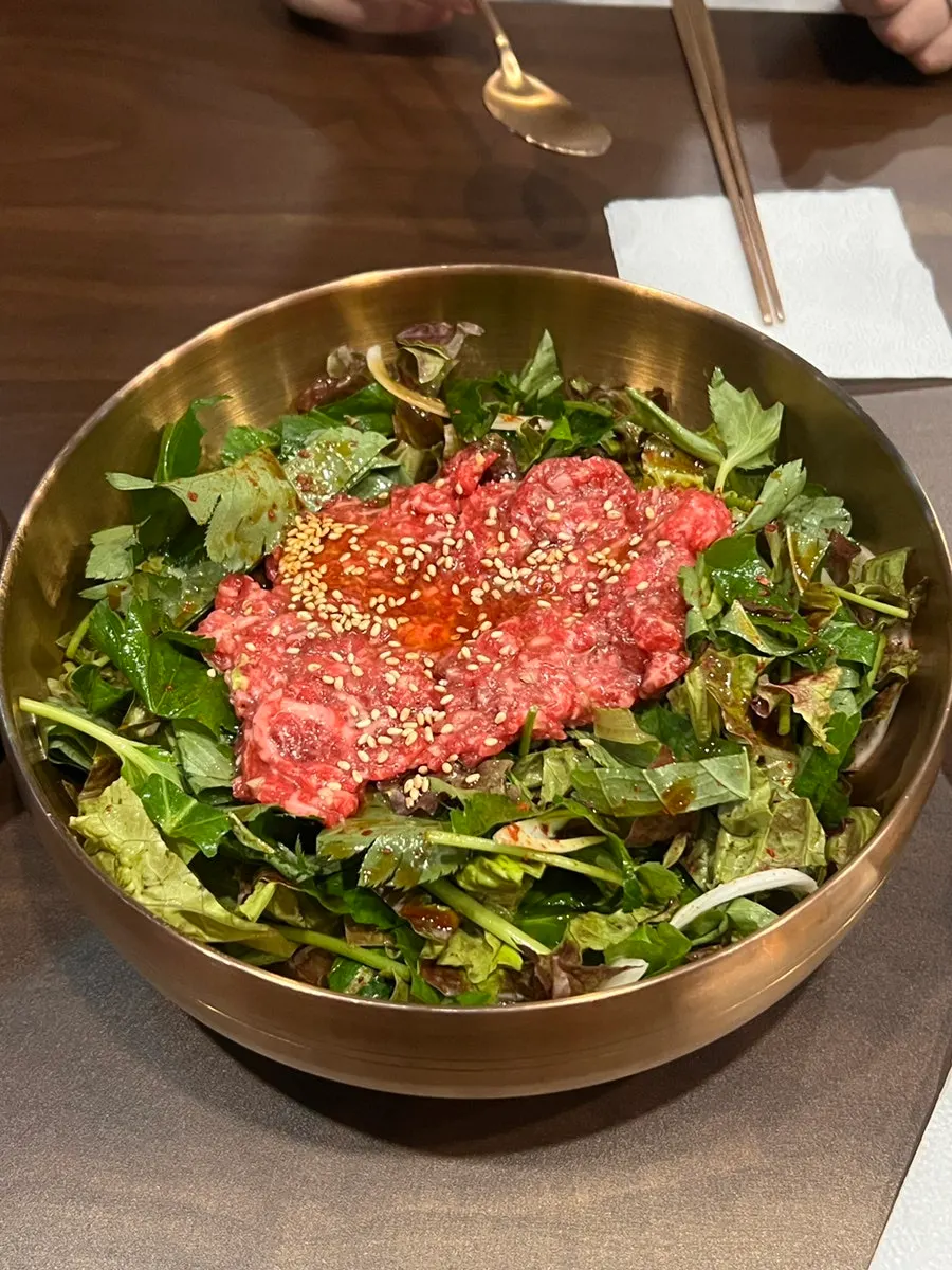 Yukhwang's yukhoe bibimbap served in a brass bowl