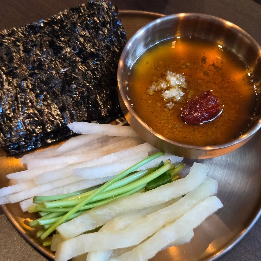 Yukhoe served with radish and pear