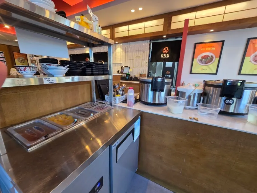 Self-serve bar with rice, soup, and broth