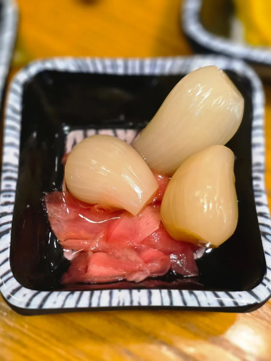 Broth and side dishes brought from the self-serve bar