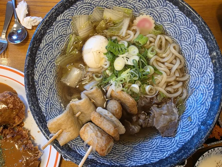 Udon broth topped with skewered fish cake