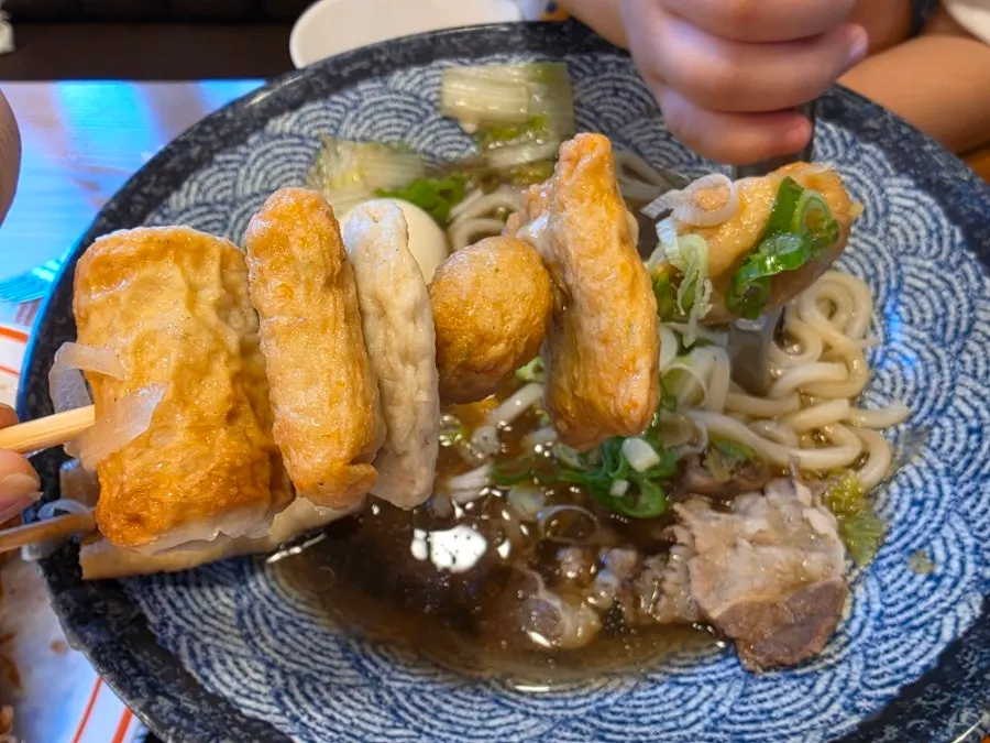 Udon noodles and broth in the fish cake udon