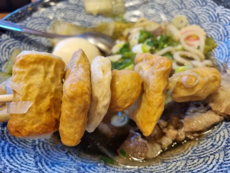 Udon noodles lifted from the bowl
