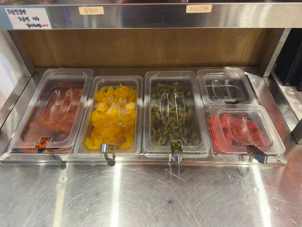 Gatjidong's self-serve bar with rice, soup, and stew