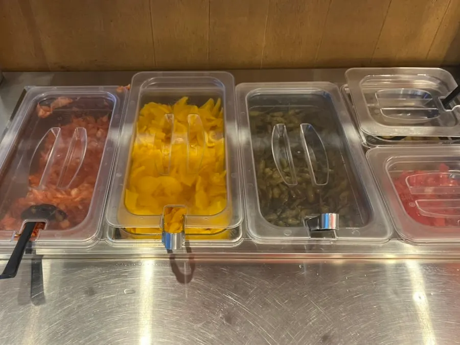 Soup and broth ready at the self-serve bar