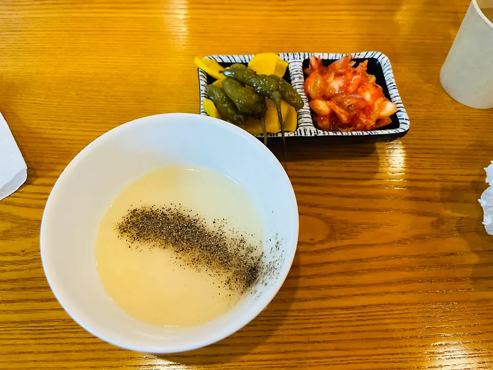 Plate of soup and side dishes taken from the self-serve bar