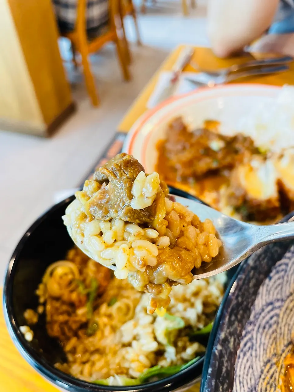 Close-up of curry loaded with beef brisket