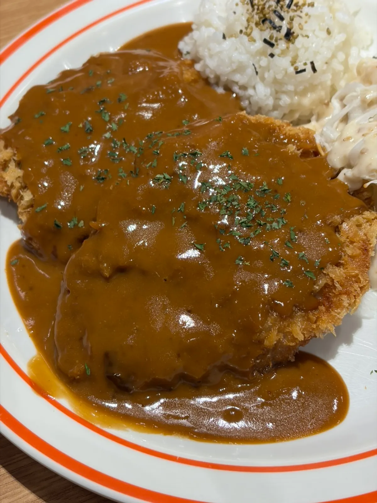 Cross-section of the sliced pork cutlet showing tender meat