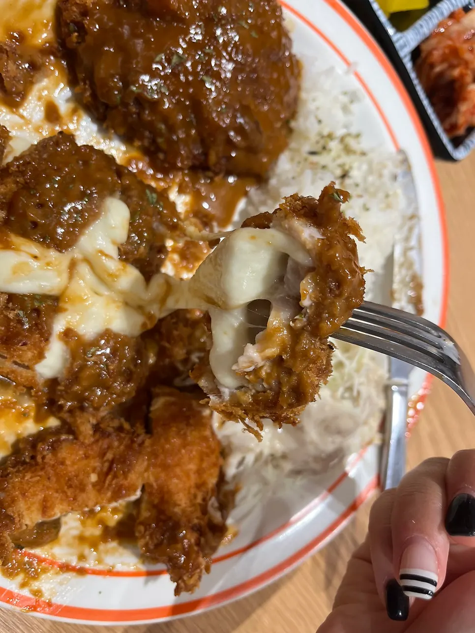 Close-up of cheese katsu showing melted cheese
