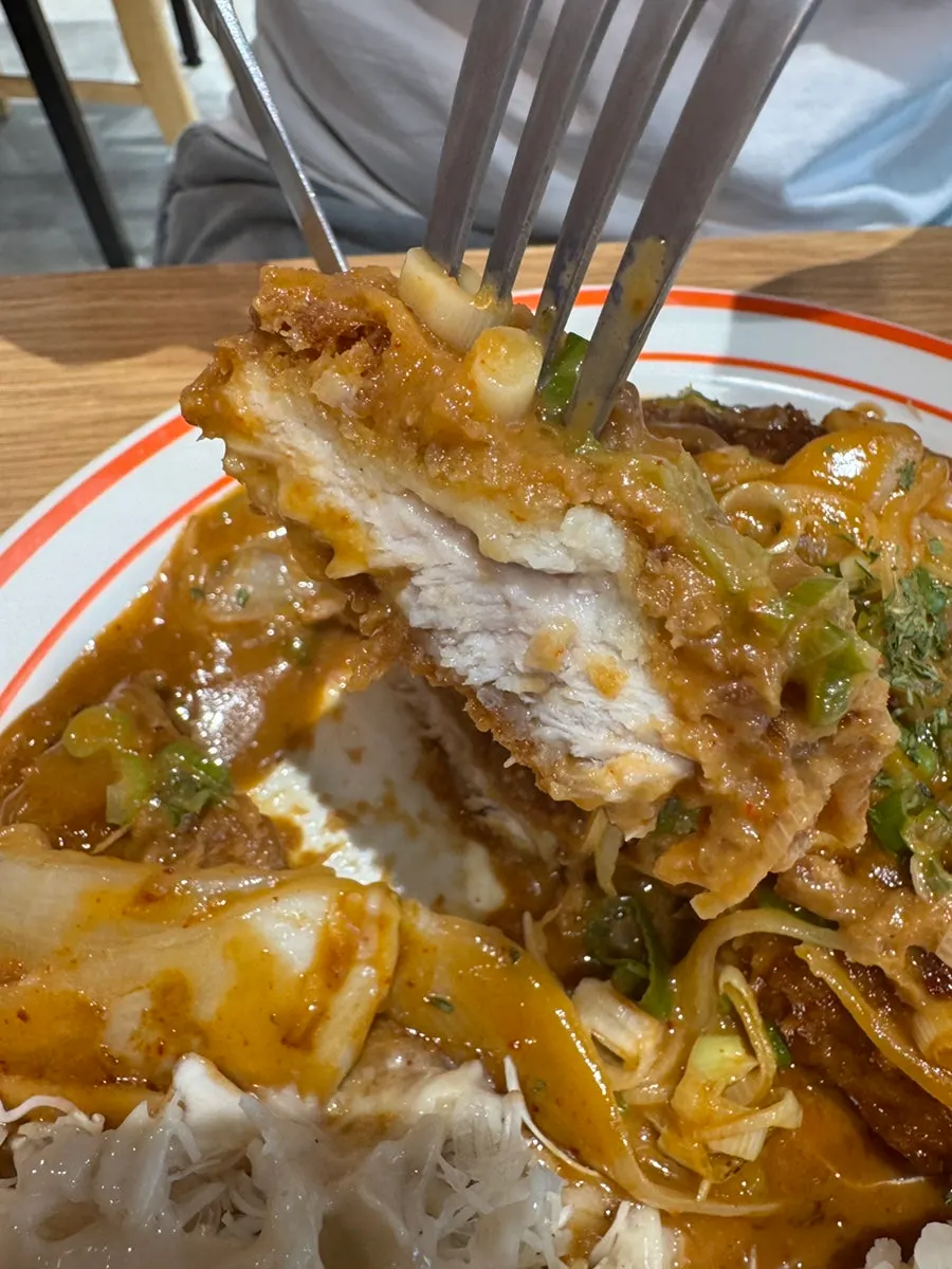 Onion pork cutlet topped with spicy sauce