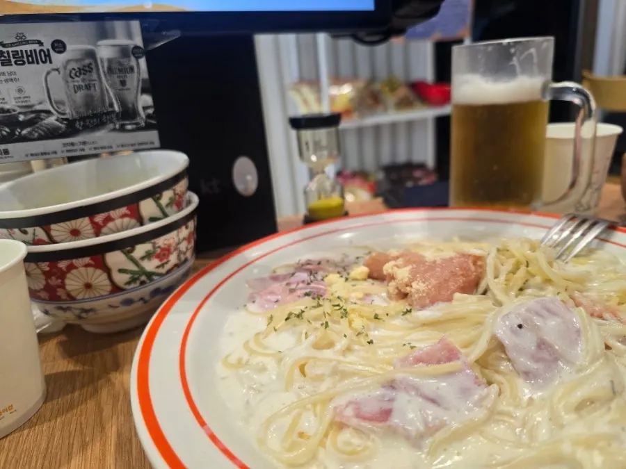A lunch spread with pork cutlet, pasta and soba together