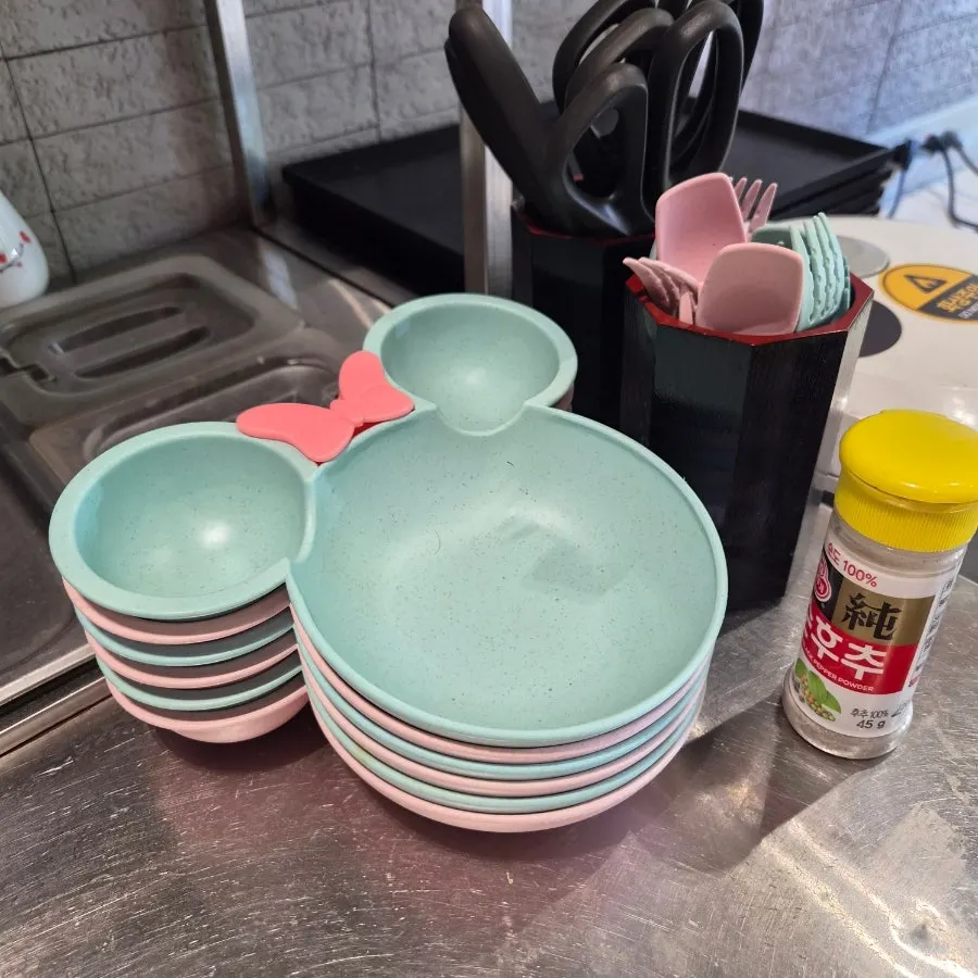Corner set up with kids' dishware and vitamins