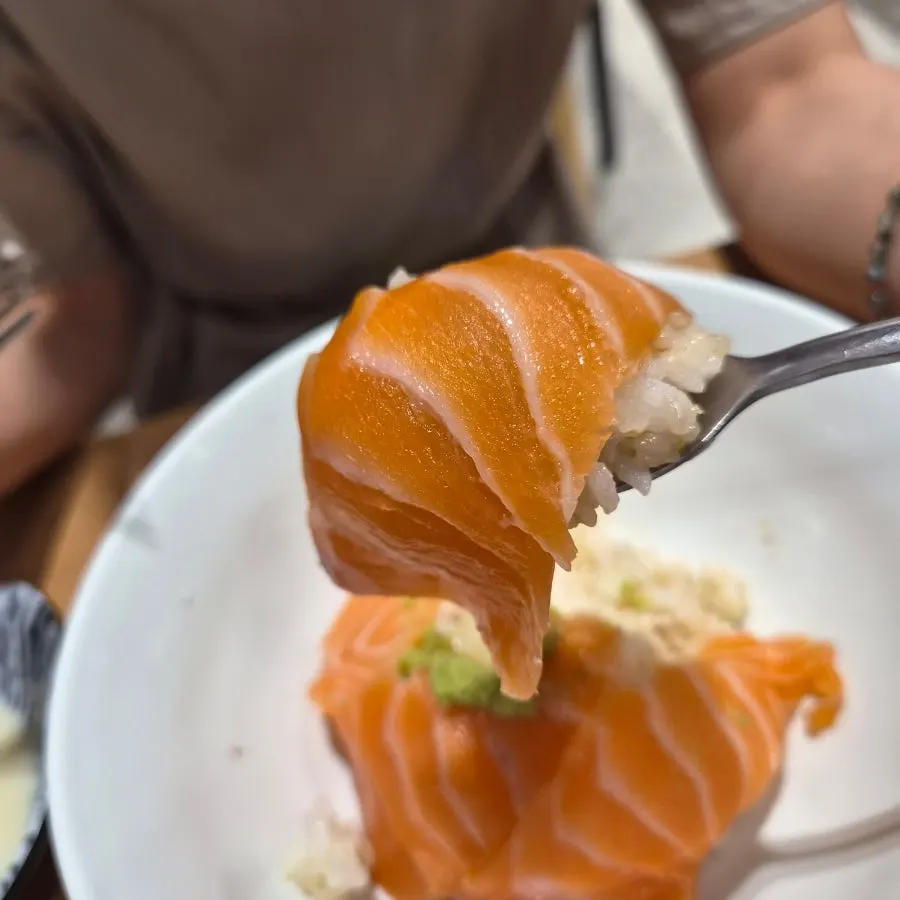 Salmon rice bowl served with wasabi and soy sauce