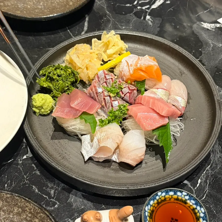 Green herb garnish served with the sashimi platter