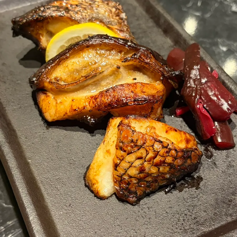 Cross-section of the grilled merou, charred outside and moist inside
