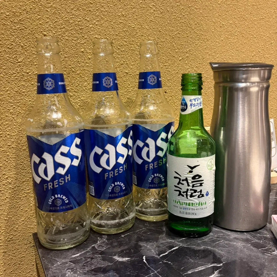 Grilled merou served alongside soju-beer cocktails