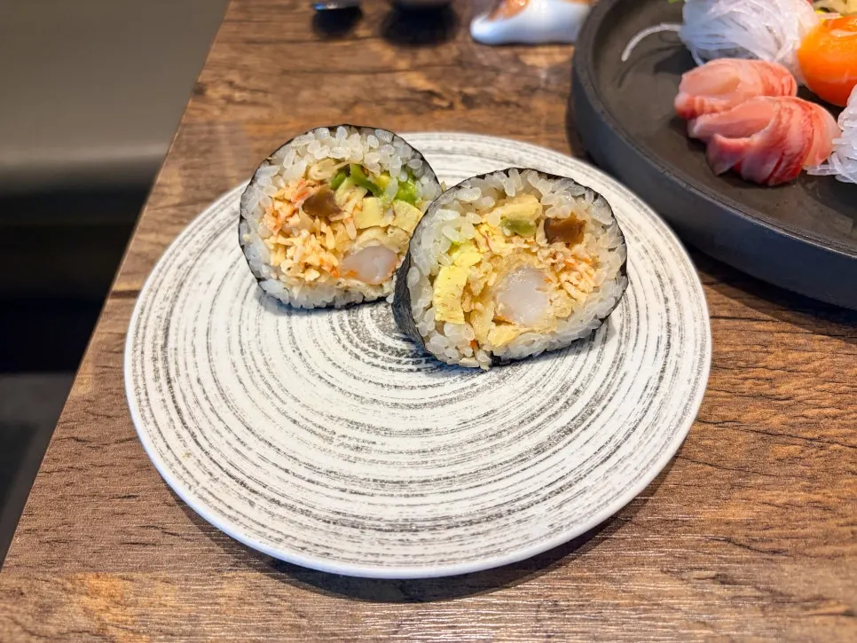 Two pieces of shrimp tempura served with the cold udon
