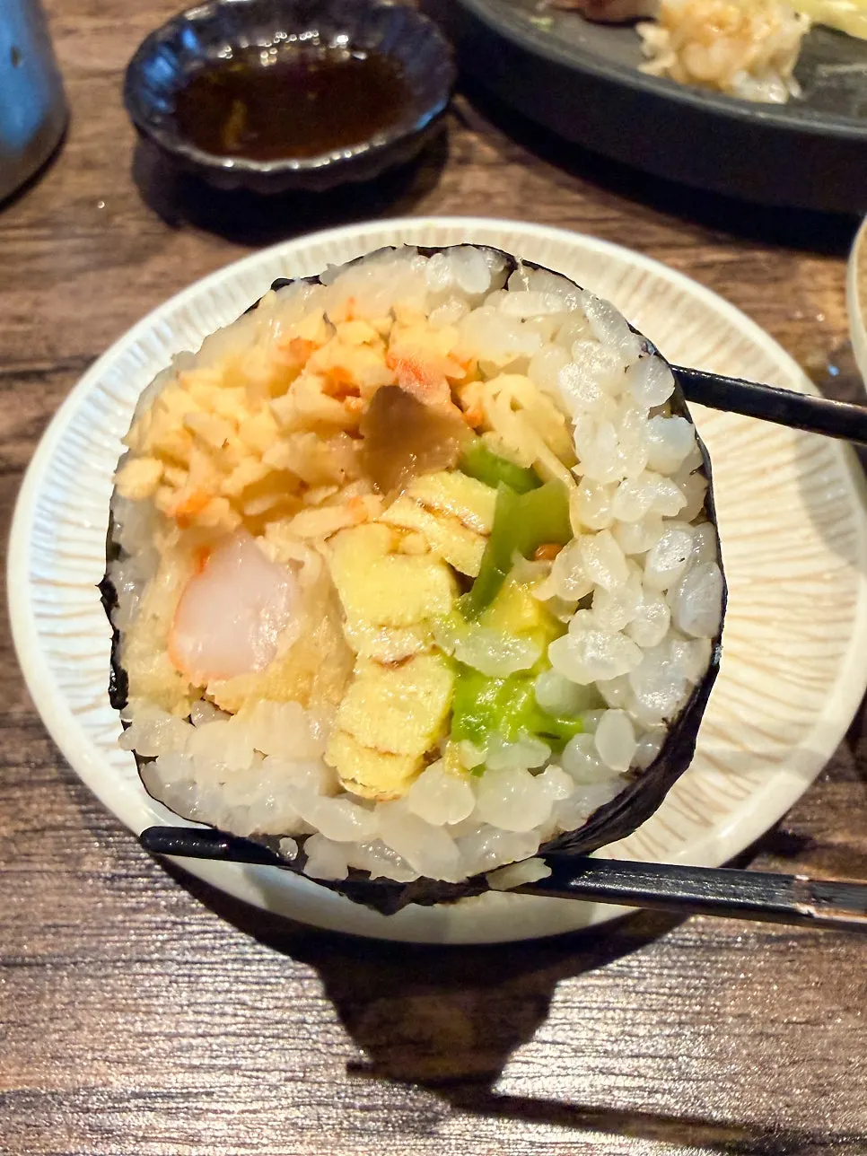 Two pieces of futomaki served on the side