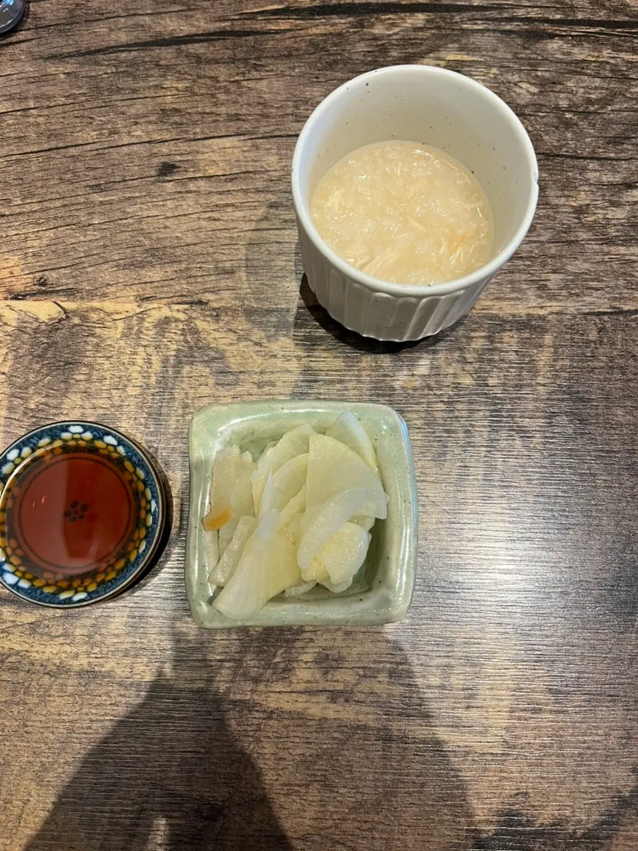 Pickled radish, soy sauce, and appetizer porridge at Gapposo