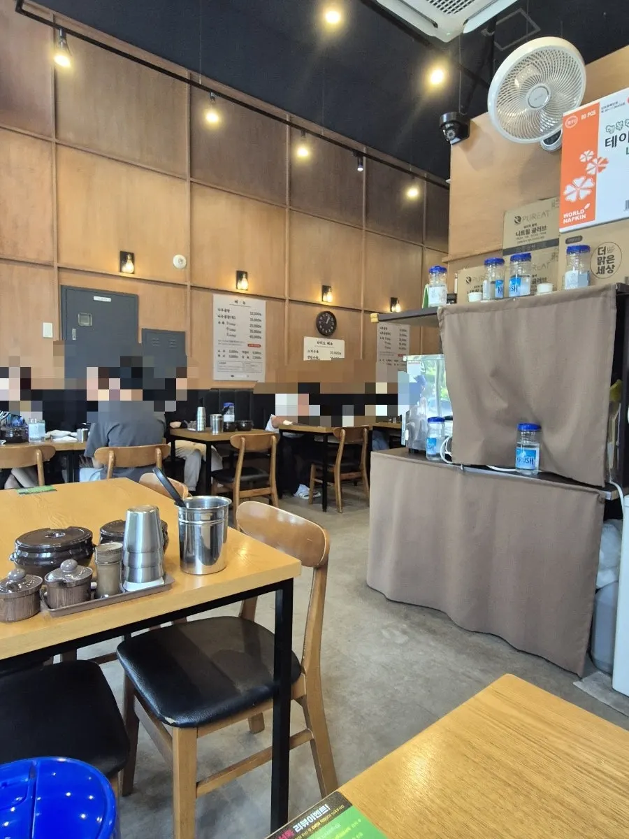 Restaurant interior with wood-toned tables