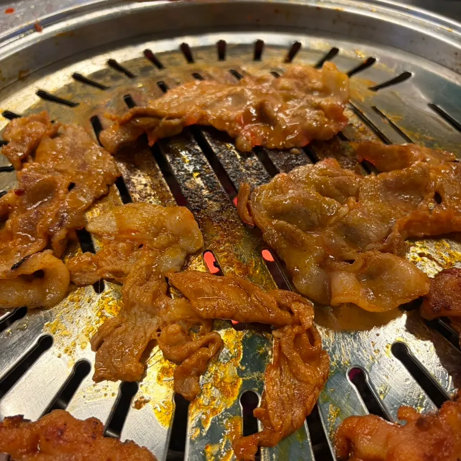 Gochujang charcoal bulgogi cooking on the grill