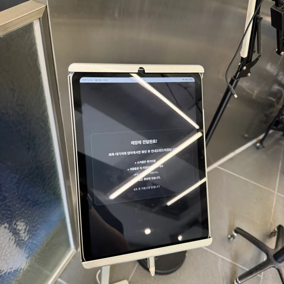 Tablet screen showing check-in completion notice