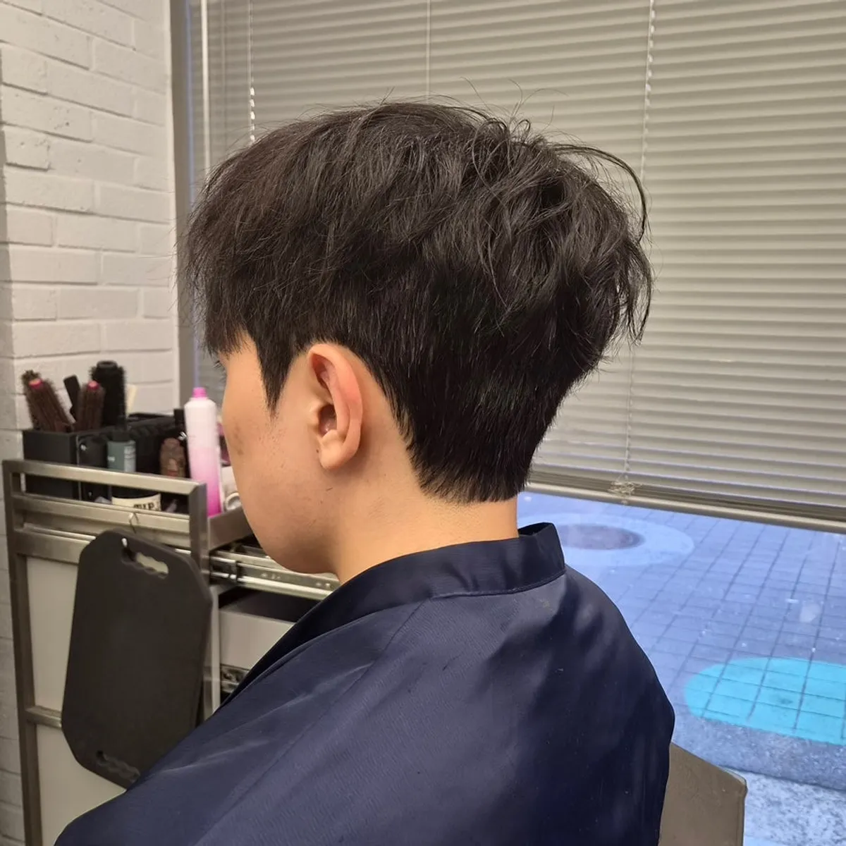 Men's hair after a down perm treatment at Geek Hair Wangsimni