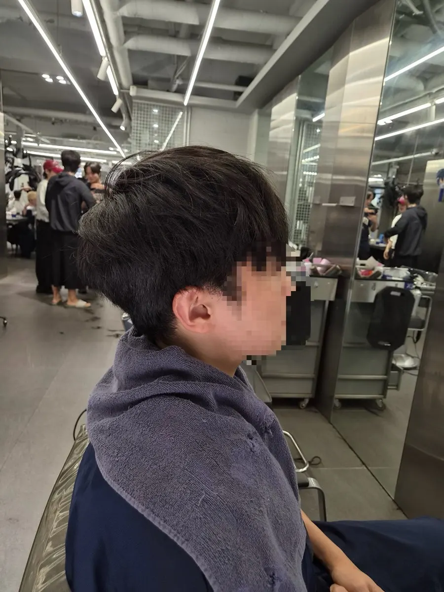 Awkwardly grown-out lower back hair before the treatment