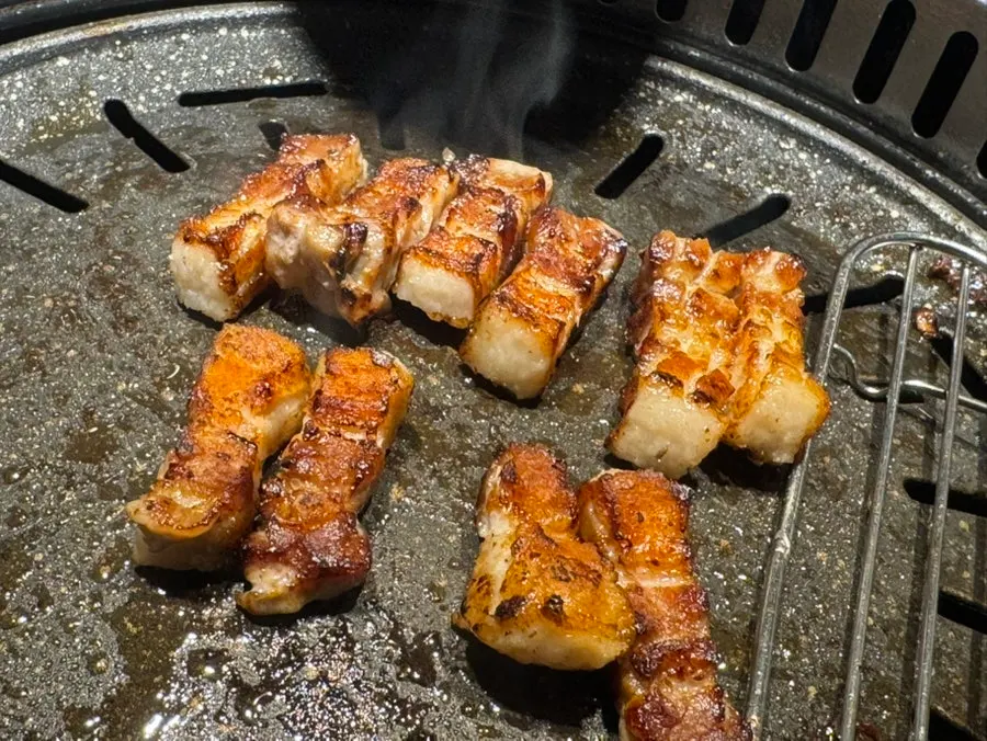 Grilled meat placed on a lettuce wrap