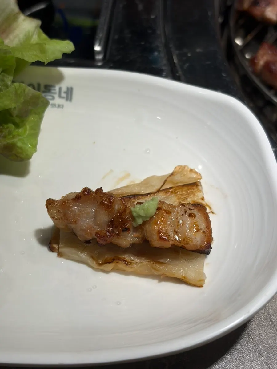 Ssam wrap with aged kimchi and meat