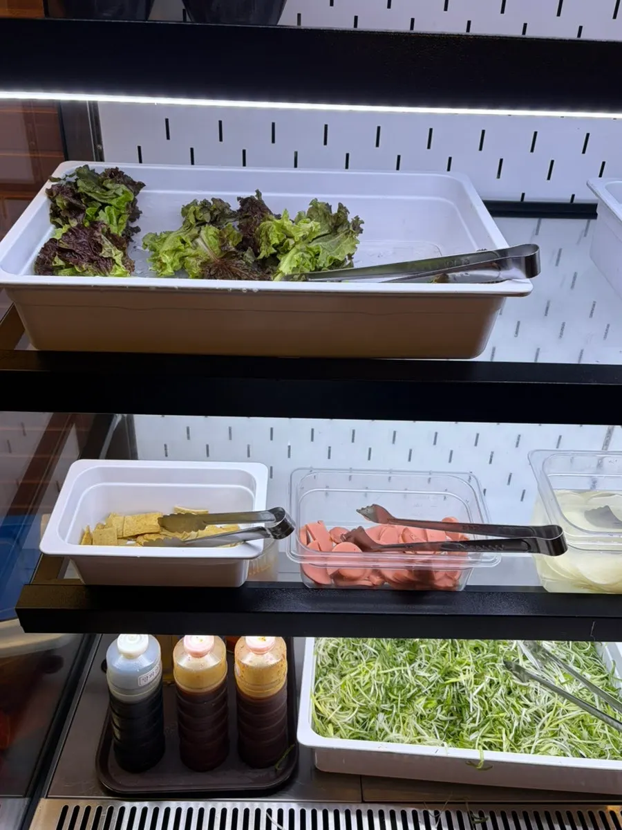 Self-serve bar with vegetables and side dishes