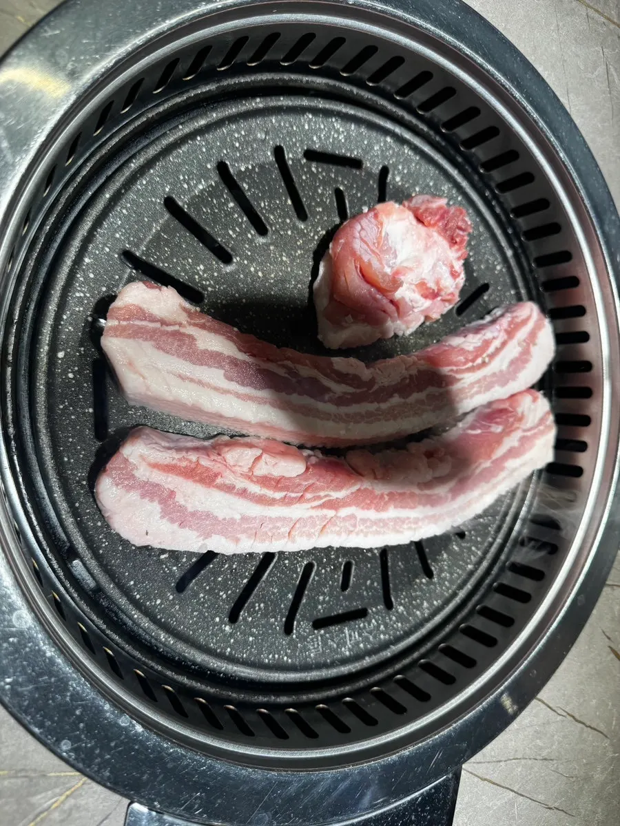 Thick aged pork belly sprinkled with coarse salt