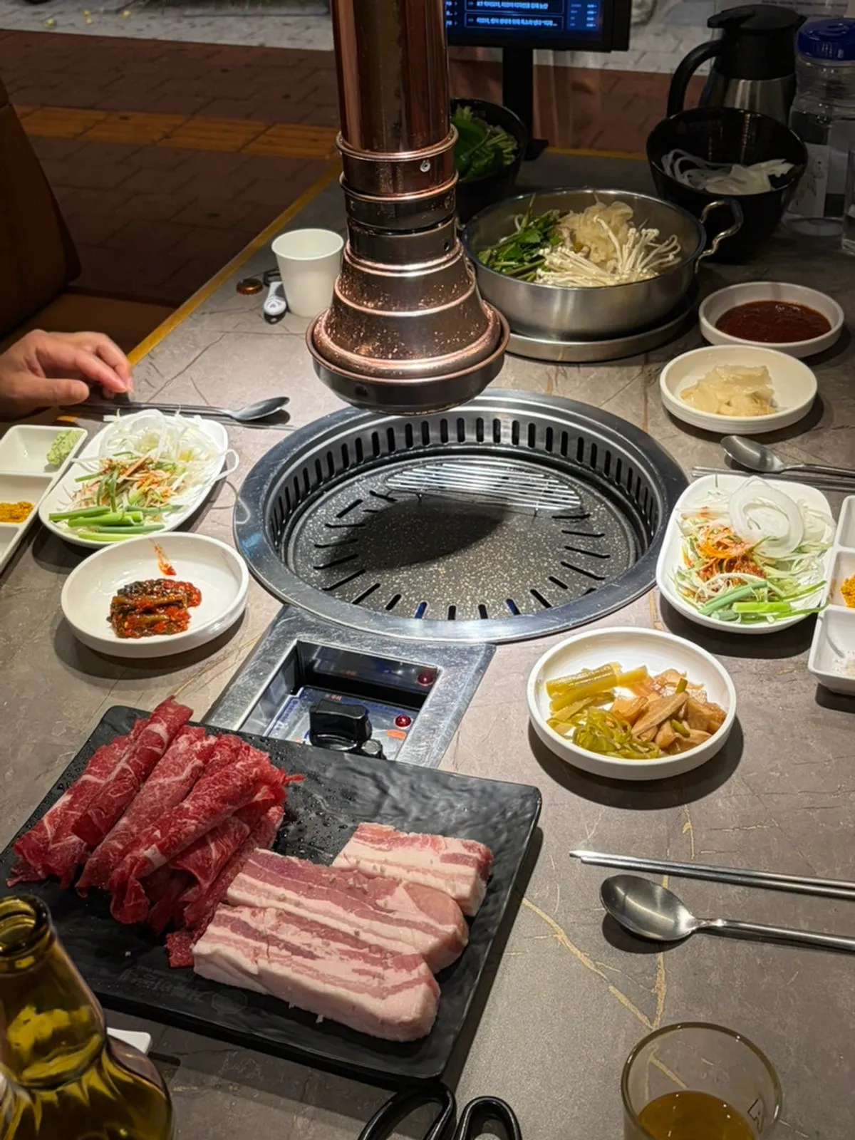 Table spread of pork belly and shabu-shabu together