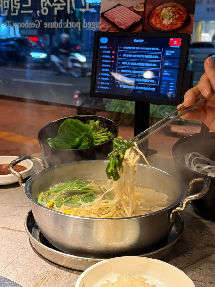 Spicy shabu-shabu pot with bok choy and mushrooms