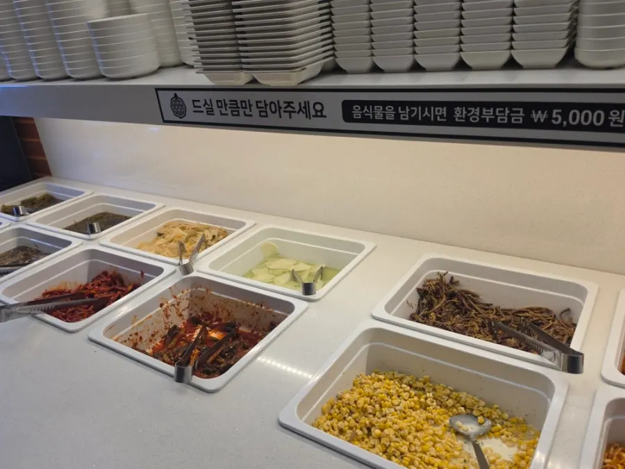 A full view of the self-serve bar with various side dishes