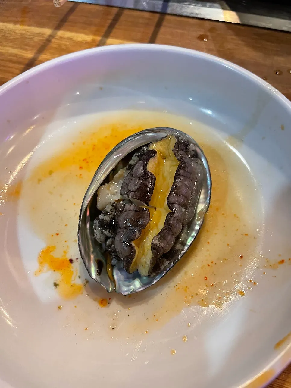 The steamed clams in broth simmering