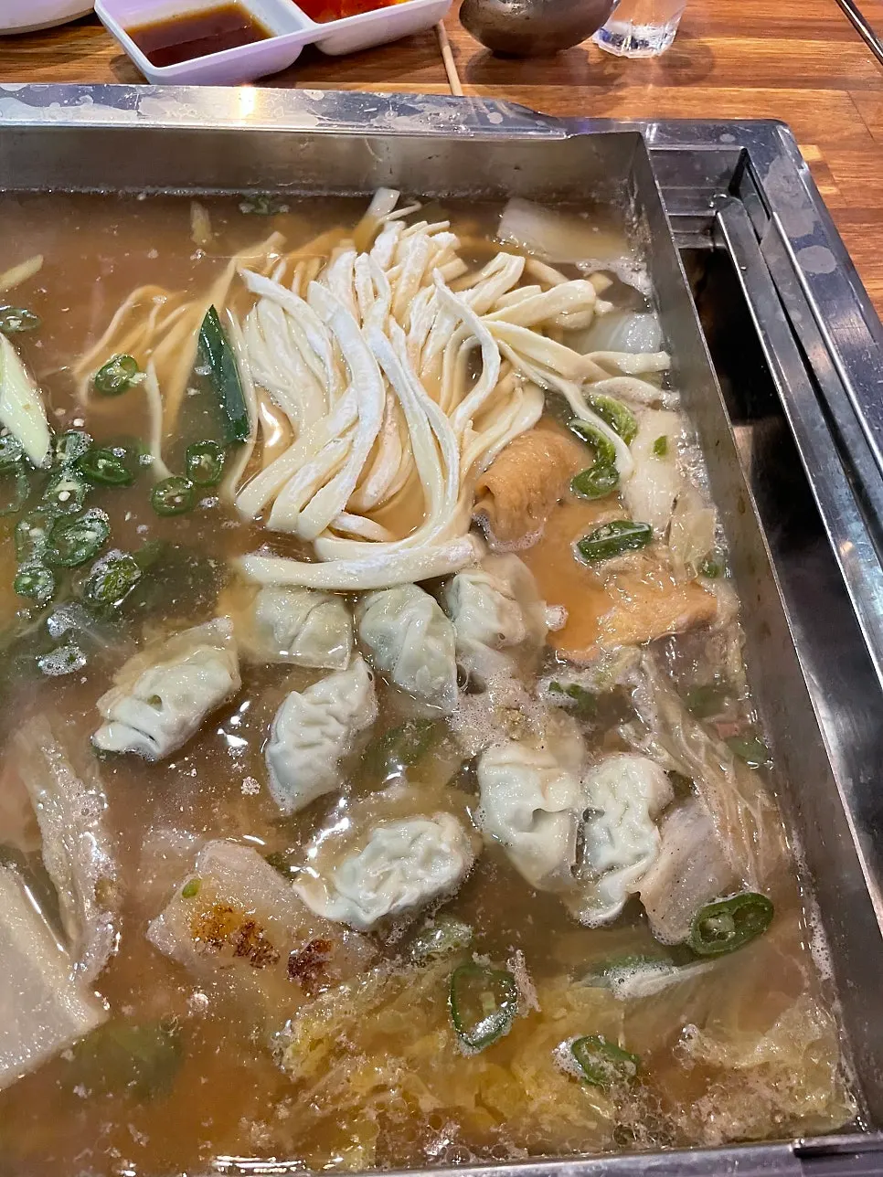 Kalguksu noodles boiled in the clam broth