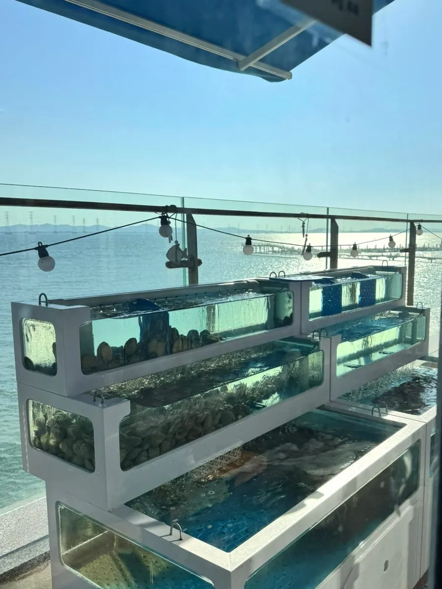Interior walkway and seating at the clam grill restaurant