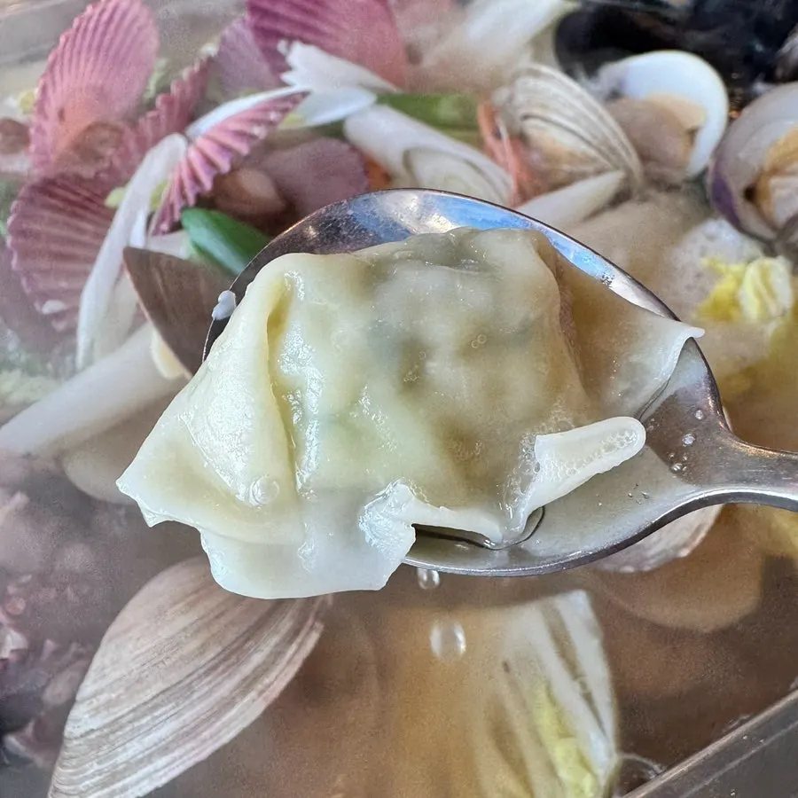 Meat served alongside the clam stew for shabu-shabu style cooking