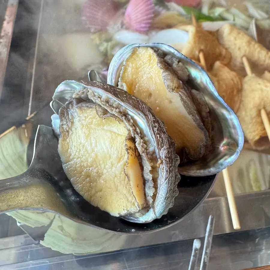 Cooked seafood dipped in cheese